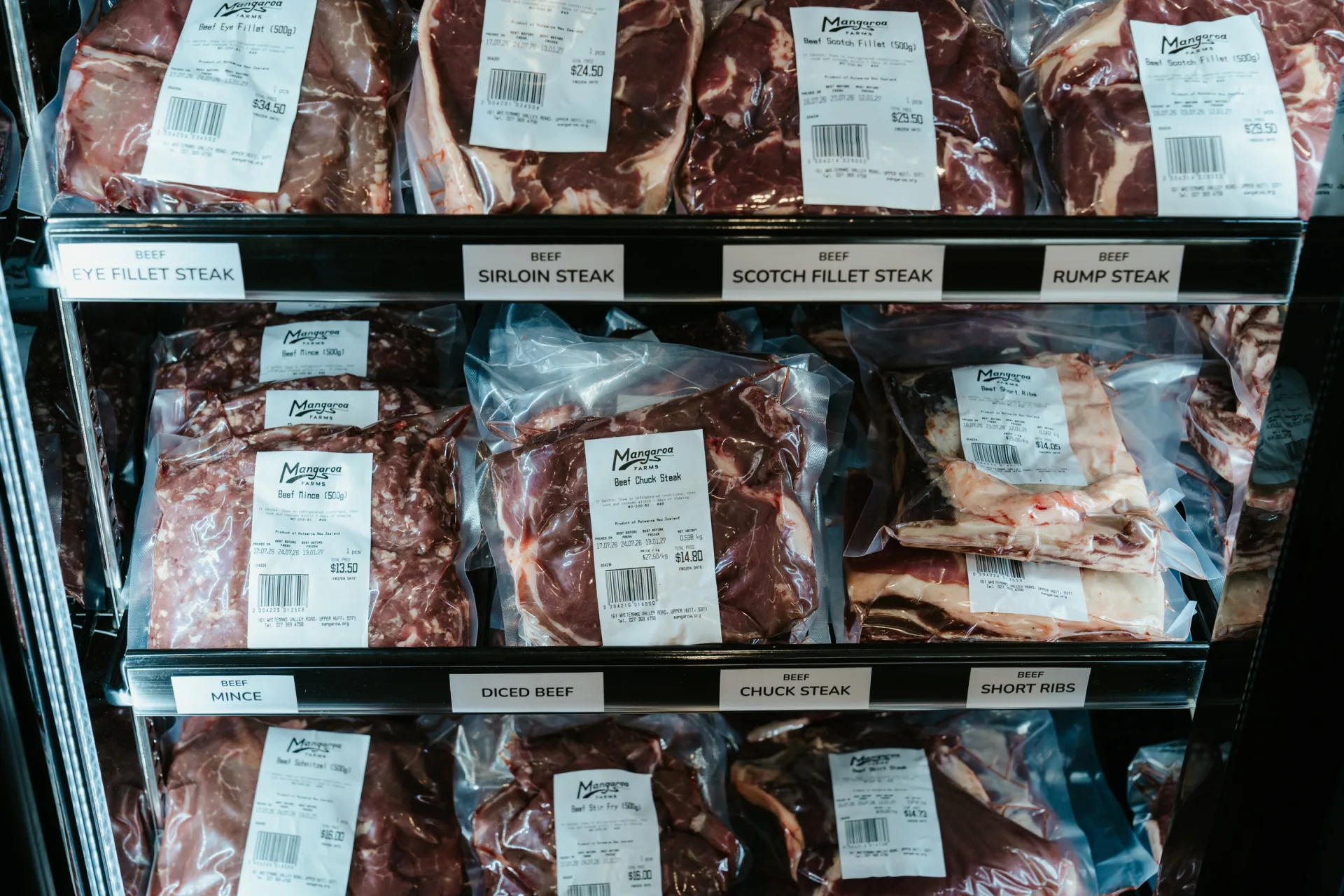 The Mangaroa Farms butchery cabinet — packed beef and lamb cuts, labelled and ready